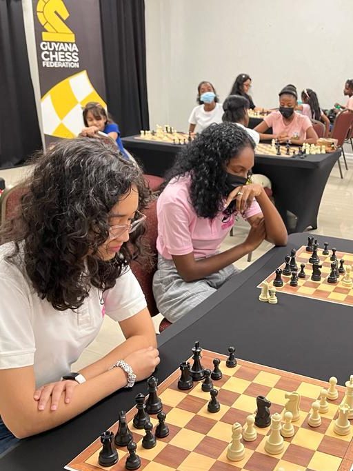 Women and girls competing at a Guyana chess event